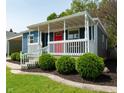 Blue house with white porch and landscaping at 50 N Edmondson Ave, Indianapolis, IN 46219