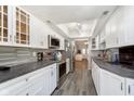 Modern kitchen with white cabinets and gray countertops at 5060 Hawthorne Way # 11, Avon, IN 46123