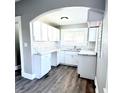 Newly renovated kitchen featuring white shaker cabinets, marble countertops, and subway tile backsplash at 52 N Mount St, Indianapolis, IN 46222