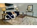 Living room features a blue couch, wood coffee table, and area rug at 5634 Dapple Ct, Indianapolis, IN 46228