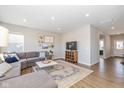 Spacious living room featuring a sectional sofa and large windows at 8576 Jeff Cir, Brownsburg, IN 46112