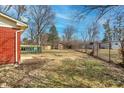 Spacious backyard featuring a deck, shed, and a combination of fenced and open areas at 10905 College Place Dr, Carmel, IN 46280