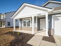 Welcoming single-Gathering home with a cozy front porch, white trim, and stylish vinyl siding at 1208 Fleming Dr, Greenfield, IN 46140