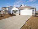 Attractive single-story home showcasing a two-car garage and a well-maintained driveway at 1208 Fleming Dr, Greenfield, IN 46140