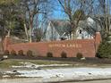 Brick entryway sign for Warren Lakes community at 1520 Wilford Ln, Indianapolis, IN 46229
