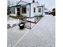 Front view of a ranch home with a snow-covered driveway and landscaping at 3305 S New Jersey St, Indianapolis, IN 46227