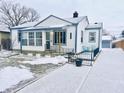 White ranch home with blue accents and a snow-covered yard at 3305 S New Jersey St, Indianapolis, IN 46227