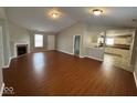 Spacious living room with hardwood floors and fireplace at 3371 Lauren Dr, Indianapolis, IN 46235