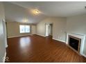 Open living area featuring hardwood floors and a fireplace at 3371 Lauren Dr, Indianapolis, IN 46235