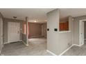 Open concept living room with grey walls and flooring and a large window at 352 Parkview Dr, Danville, IN 46122