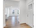 Bright entryway with light hardwood floors and view into living room at 5751 Cr W 750 N, McCordsville, IN 46055