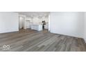 Open living room and kitchen with hardwood floors at 5751 Cr W 750 N, McCordsville, IN 46055