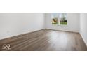 Spacious bedroom with hardwood floors and large windows at 5755 Cr W 750 N, McCordsville, IN 46055