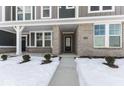Attractive townhouse entrance with brick facade, porch, and walkway at 5763 Cr W 750 N, McCordsville, IN 46055