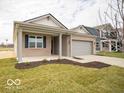 Attractive single-story home with a covered entry and well-groomed lawn and landscaping at 6047 Granby Dr, Whitestown, IN 46075