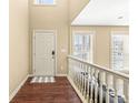 Bright and airy entryway with hardwood floors and railing at 7161 Caversham Pl, Indianapolis, IN 46278