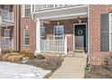 Inviting front entrance with brick facade and porch at 7161 Caversham Pl, Indianapolis, IN 46278