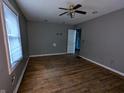 Simple bedroom with hardwood floors and a ceiling fan at 837 S Warman S Ave, Indianapolis, IN 46221