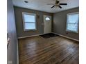 Living room featuring hardwood floors and a ceiling fan at 837 S Warman S Ave, Indianapolis, IN 46221