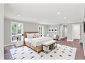 Serene main bedroom with light gray walls, wood floors, and natural light at 8602 Frontgate Ln, Indianapolis, IN 46256