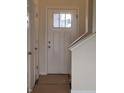 Bright white front door featuring a window pane providing natural light to the entryway at 1078 Tomahawk Pl, Martinsville, IN 46151
