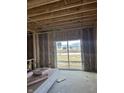 Interior framing of a room with a sliding glass door and winter view at 1078 Tomahawk Pl, Martinsville, IN 46151