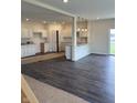 Spacious kitchen with white cabinets, granite countertops and stainless steel appliances at 1078 Tomahawk Pl, Martinsville, IN 46151