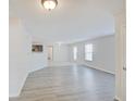 Open living room with gray vinyl plank flooring at 12674 Endurance Dr, Fishers, IN 46037