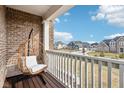 Relaxing balcony with a hanging chair and neighborhood view at 14292 Dufton Ct, Carmel, IN 46074