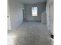 Spacious living room with large window and neutral walls at 1440 Wigwam Ln, Martinsville, IN 46151