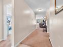 Hallway with carpet and light peach walls at 1710 Elderberry Dr, Indianapolis, IN 46234