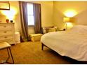 Bright bedroom with large bed, dresser, and window at 1842 Queensbridge Dr, Indianapolis, IN 46219