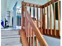 Wooden staircase with simple railing and baby gate at 1842 Queensbridge Dr, Indianapolis, IN 46219