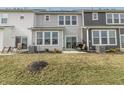 Townhome backyard with small patio, grill, and lawn at 18655 Moray St, Westfield, IN 46069
