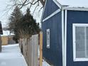 Blue detached garage with white trim, winter scene at 2317 Fowler St, Anderson, IN 46012