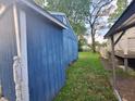 This image captures a side view of the house, including exterior walls and landscaping at 2317 Fowler St, Anderson, IN 46012