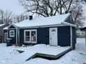 Blue house with white trim, snow covered deck at 2317 Fowler St, Anderson, IN 46012