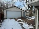 Detached garage with brick driveway and snow on the ground at 2442 Asbury St, Indianapolis, IN 46203