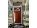Red front door with a window and welcome mat at 2507 Redland Ln, Indianapolis, IN 46217
