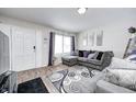 Cozy living room featuring a comfortable couch and nice natural light through the window at 3647 Richelieu Rd, Indianapolis, IN 46226
