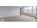 Bright bedroom with neutral carpeting and ample natural light at 385 N Post Oak Dr, Mooresville, IN 46158