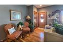 Bright entryway with hardwood floors and two orange armchairs at 5419 E Shae Lake Dr, Mooresville, IN 46158