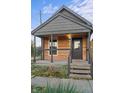 Updated bungalow exterior with gray siding and wood accents at 617 Marion Ave, Indianapolis, IN 46221