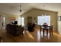 Bright living room with hardwood floors, vaulted ceilings, and dining area at 706 Shagbark Ct, Plainfield, IN 46168