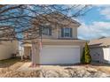 Beautiful two-story home with a manicured lawn and attached two-car garage, in a friendly neighborhood at 7730 Belmac Ln, Camby, IN 46113