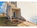 Cozy covered front porch with neutral siding, leading to a welcoming entrance of this lovely home at 7730 Belmac Ln, Camby, IN 46113