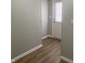Light neutral-toned entryway with wood-look flooring at 9710 E 38Th St, Indianapolis, IN 46235