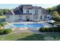 Large in-ground pool with a slide and basketball hoop; backyard oasis at 10100 Sanctuary Dr, Brownsburg, IN 46112