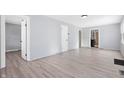 Spacious living room with light gray walls and wood-look flooring at 1629 Sharon Ave, Indianapolis, IN 46222