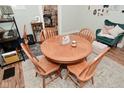 Well-lit dining area with a traditional wooden table and seating for four at 1719 Fletcher Ave, Indianapolis, IN 46203
